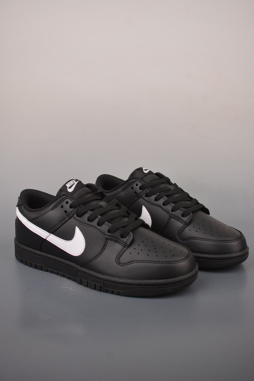 Nike SB Dunk Low "Black White Swoosh"